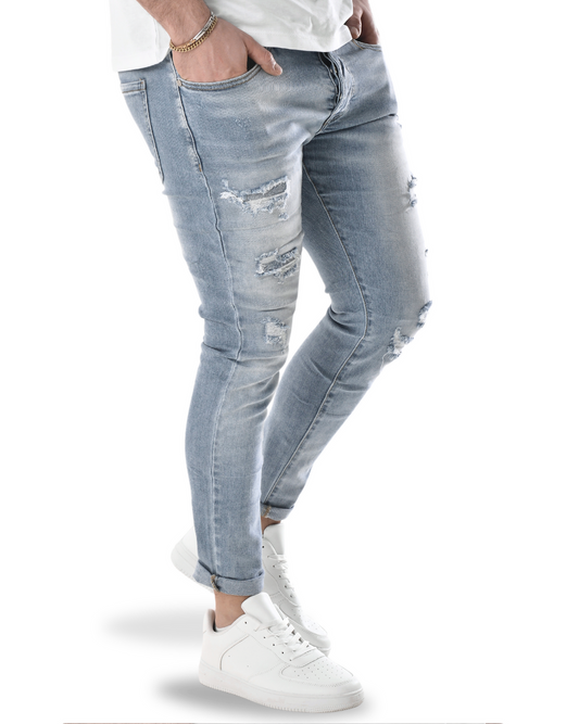 Jeans slim con piccoli strappi 7551b