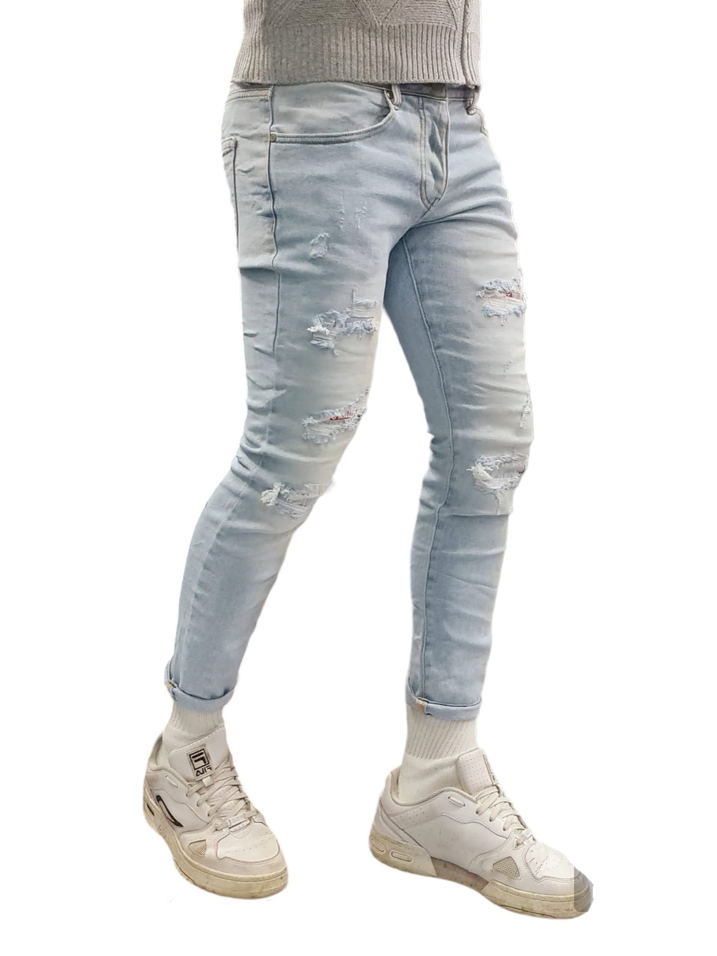 Jeans slim con piccole rotture e toppe sottostanti